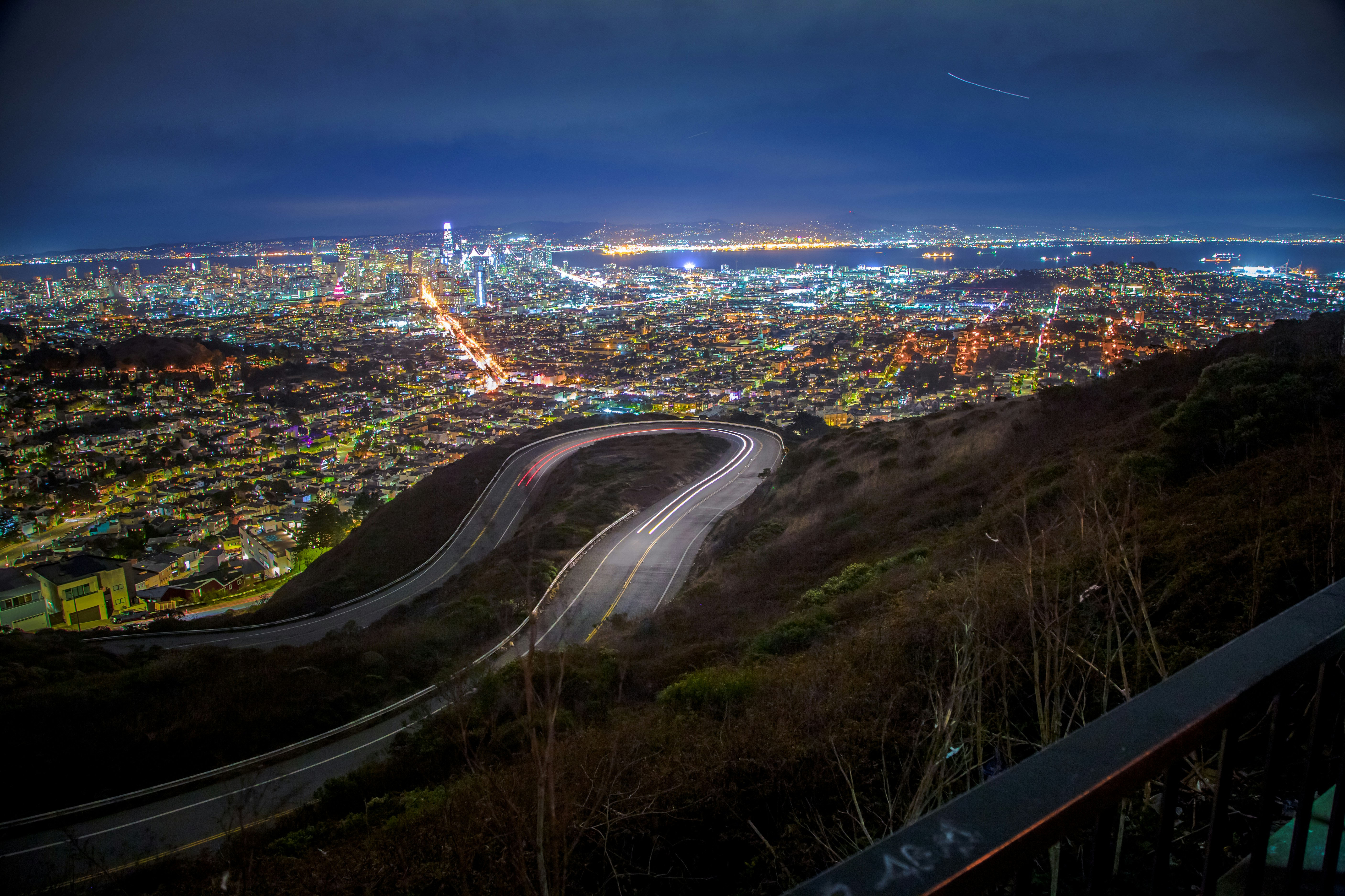 A view of a city at night from the top of a hill photo Free Christmas