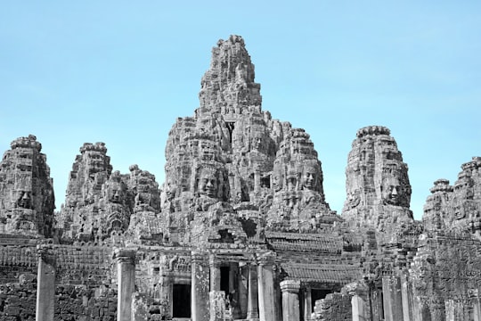 gray concrete building under blue sky during daytime in Angkor Thom Cambodia