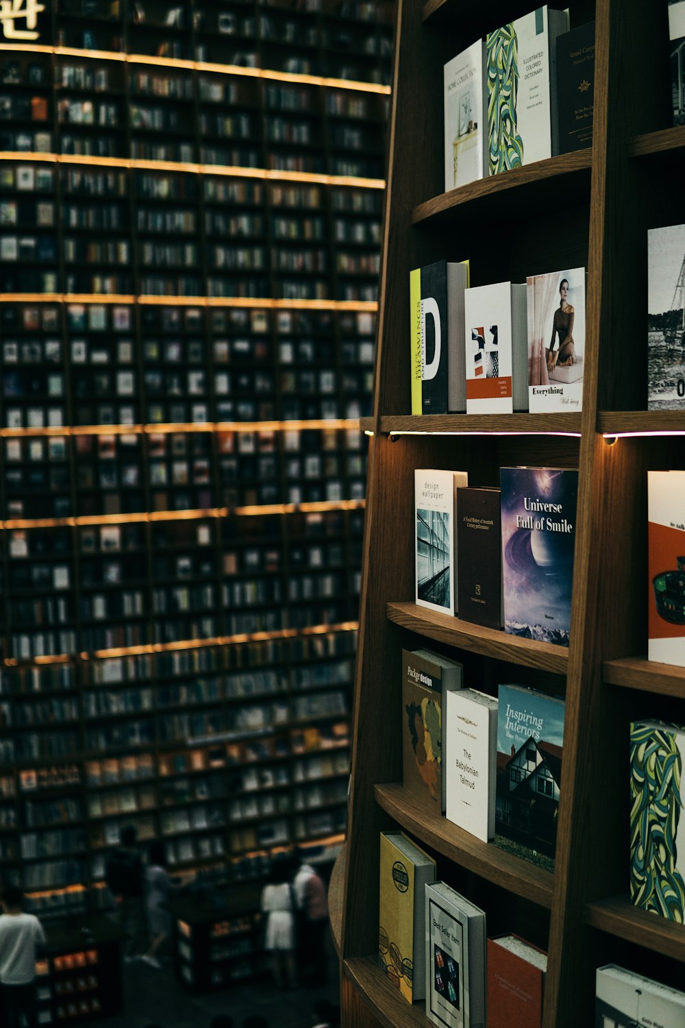 books on brown wooden shelf