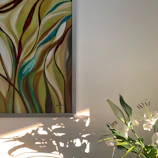 Bright floral digital art on canvas hanging in a modern living room.