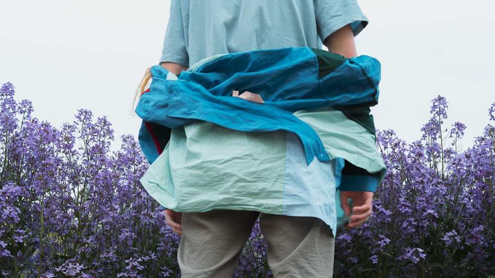 person in gray t-shirt and green pants