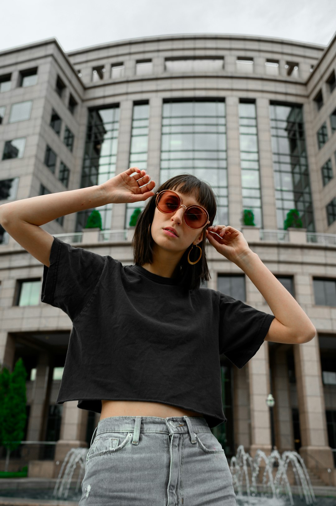woman in black crew neck t-shirt and brown sunglasses