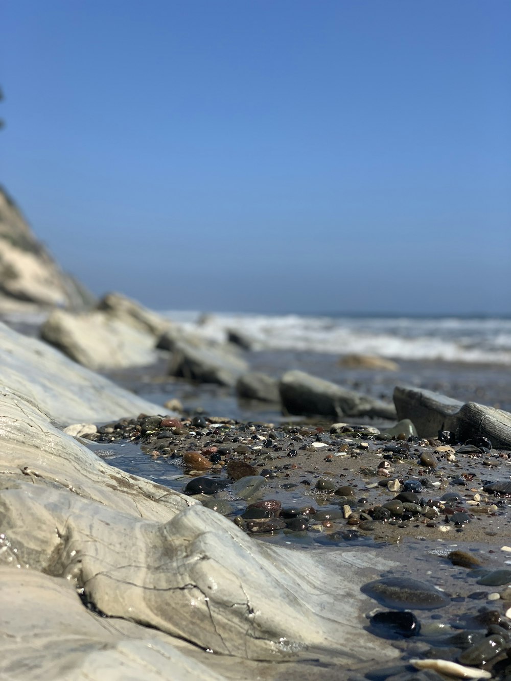 gray rocks on seashore during daytime