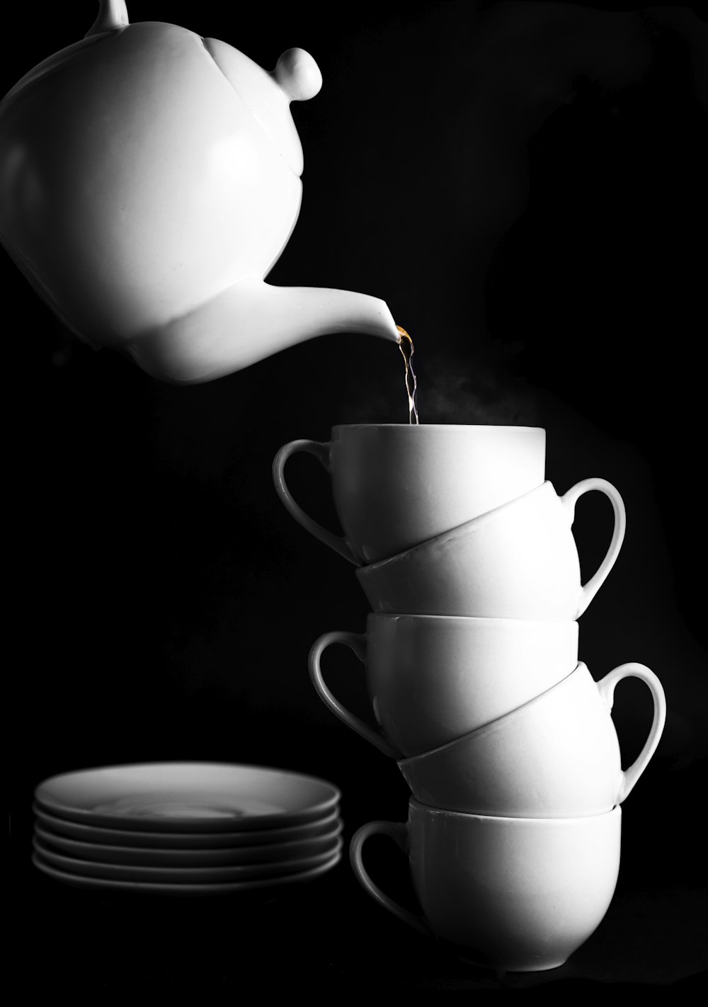 white ceramic teacup on saucer