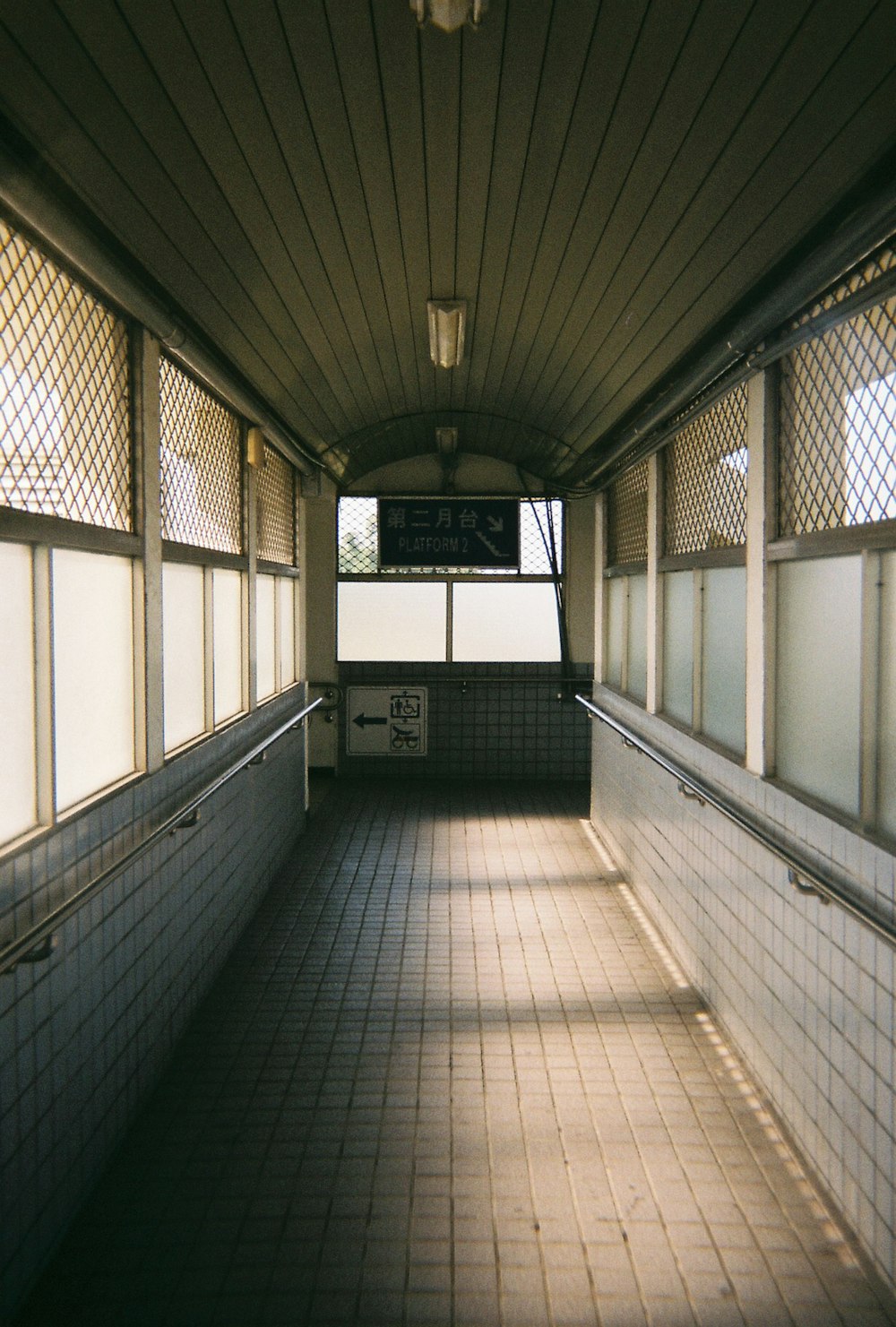 white and black hallway with glass windows