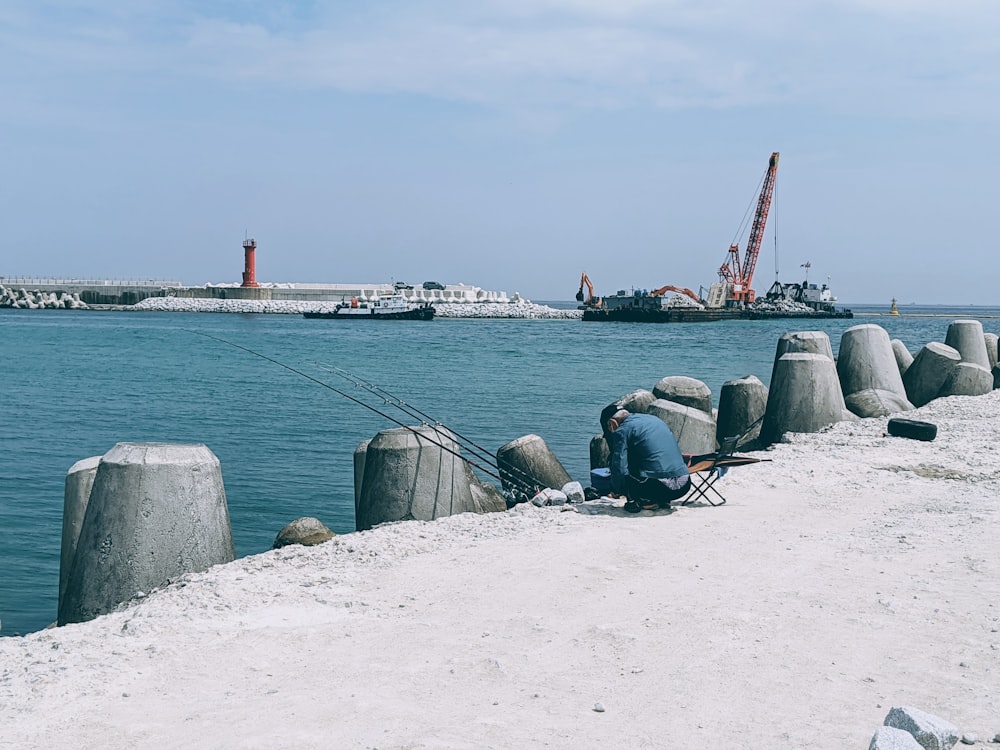 people sitting on beach shore during daytime