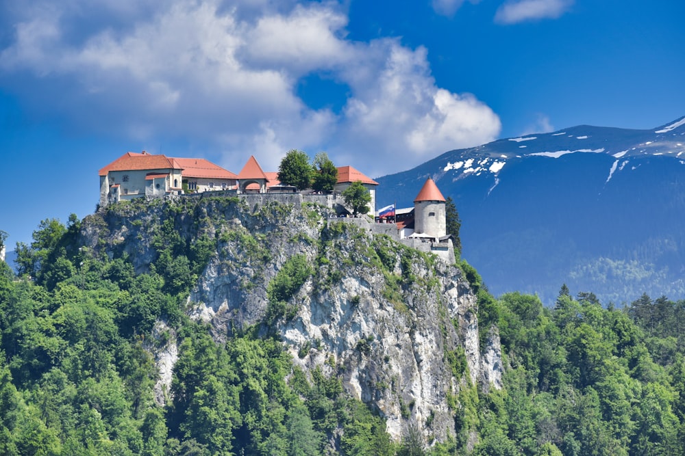 white and brown concrete house on top of mountain during daytime