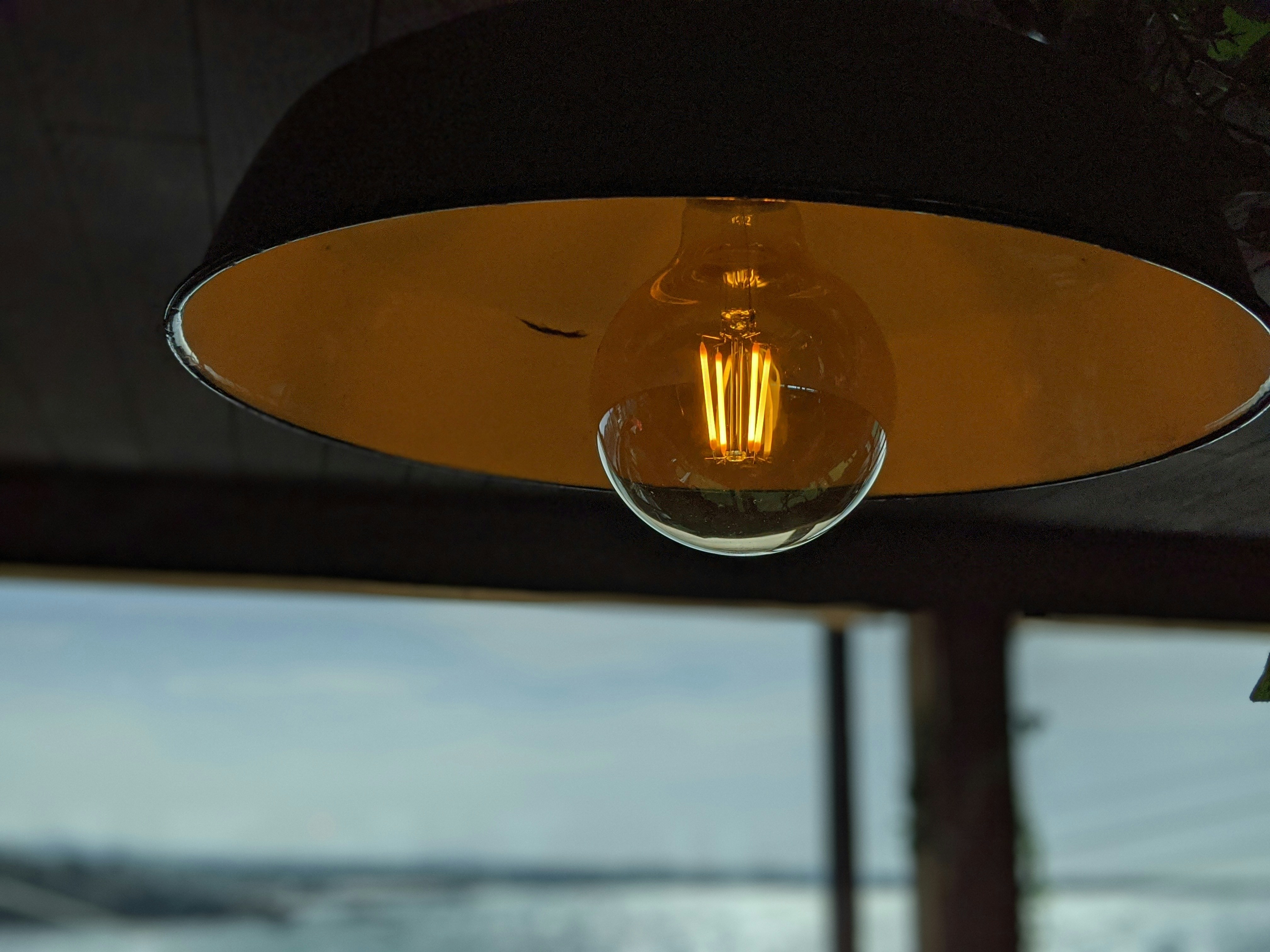 dramatic pendant lighting over a kitchen island - industrial style loft apartments