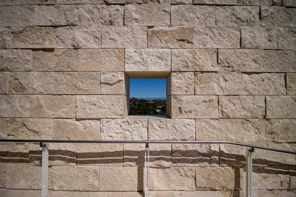 black flat screen tv on gray concrete wall