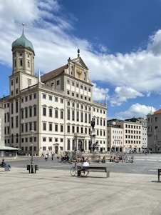 people walking near beige concrete building during daytime