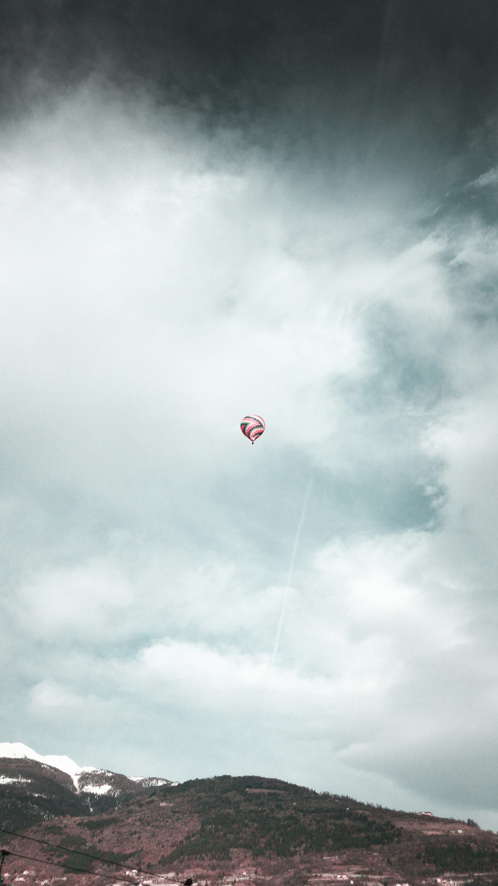 red hot air balloon in the sky