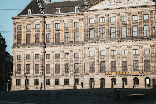 beige concrete building during daytime in Dam Square Netherlands