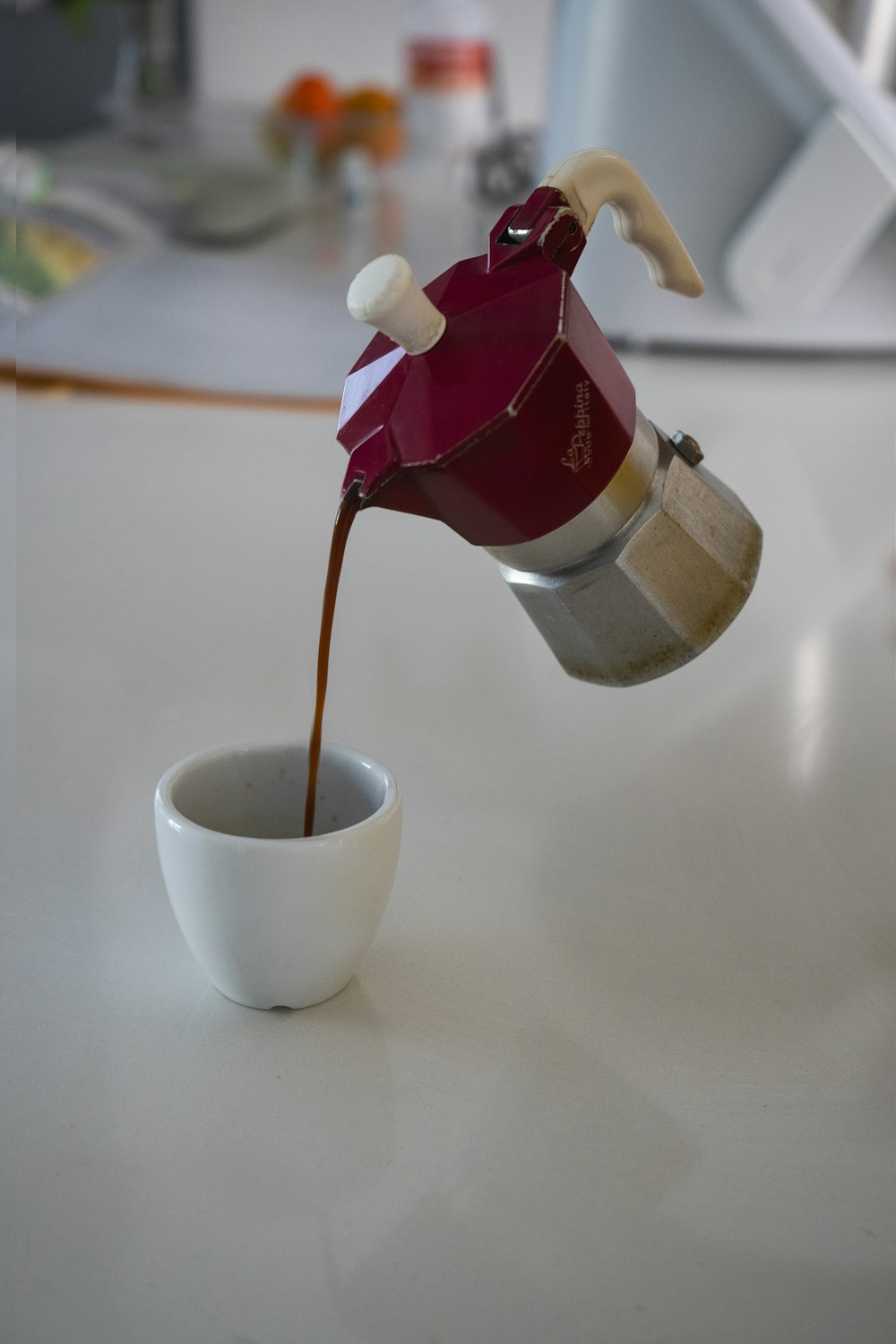 white ceramic cup with brown liquid