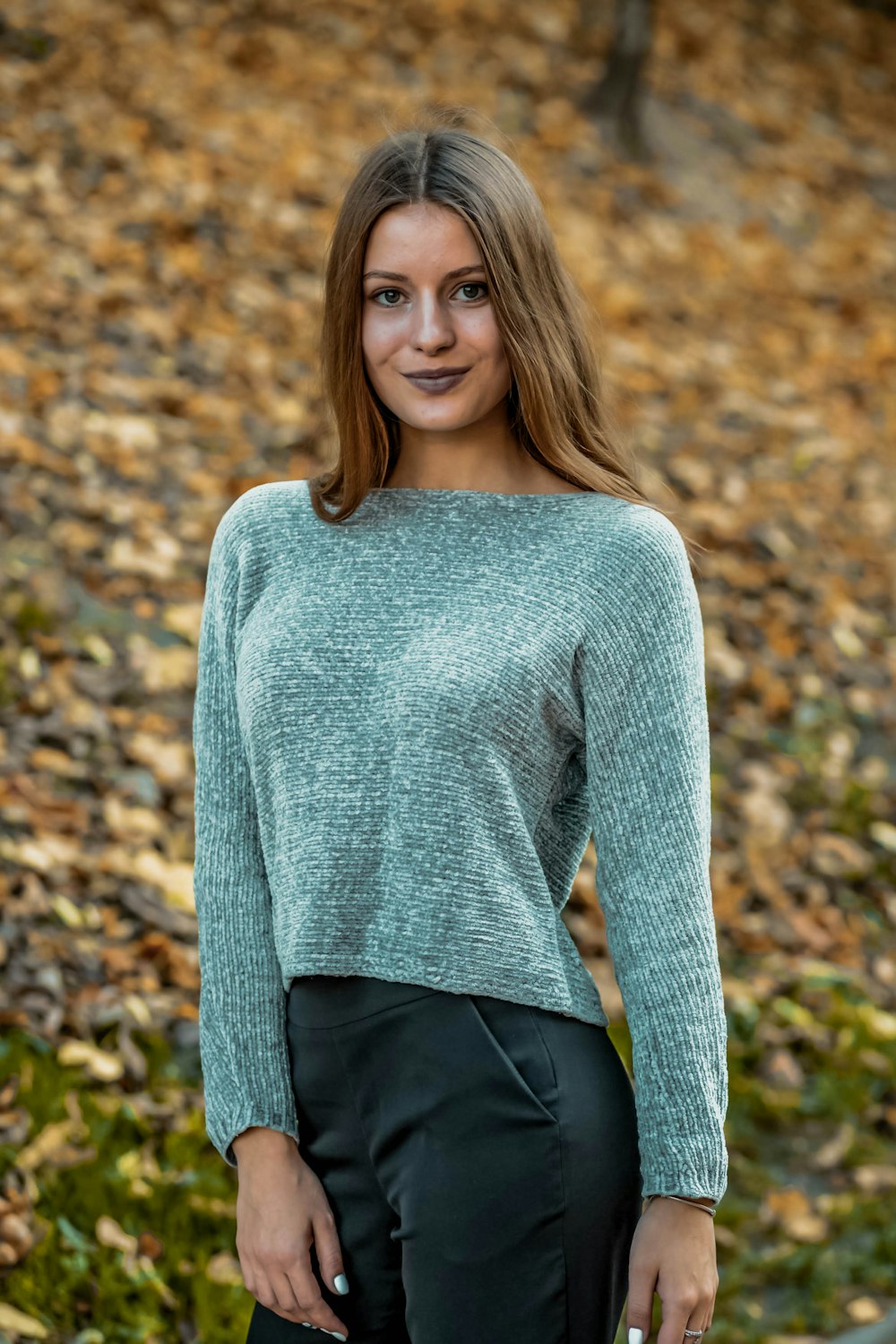 woman in gray sweater and black pants