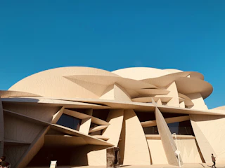 Architectural rendering of a futuristic building with unique geometric shapes