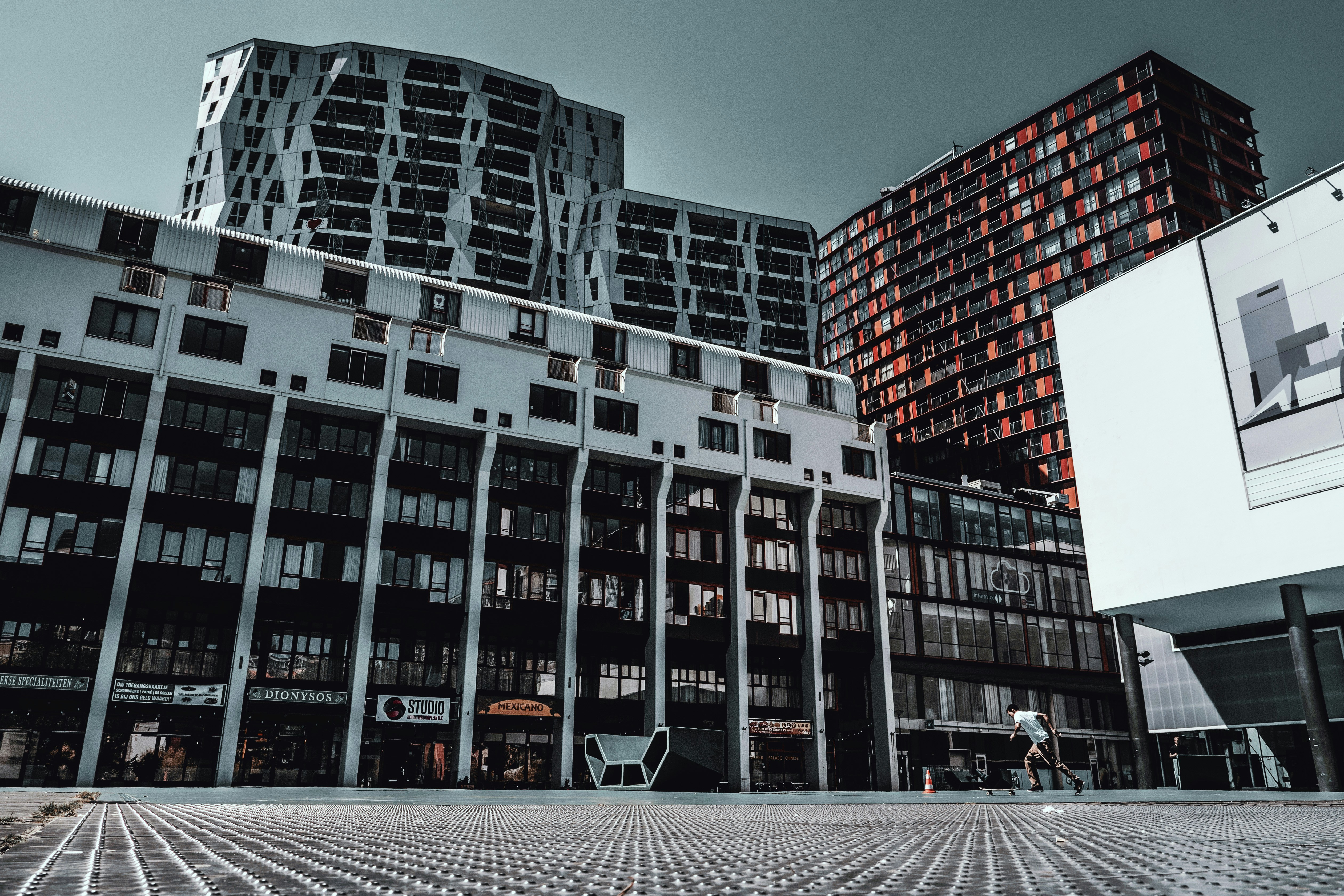 people walking on street near high rise building during daytime
