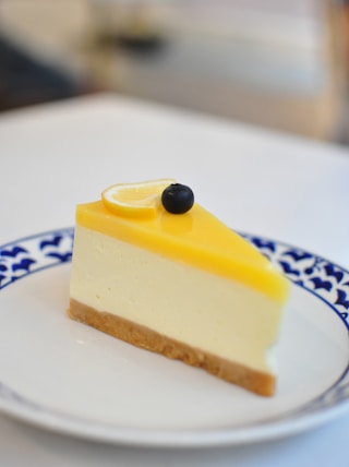 yellow cake on white and blue ceramic plate