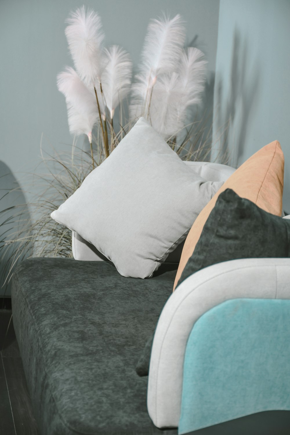 white pillow on gray couch