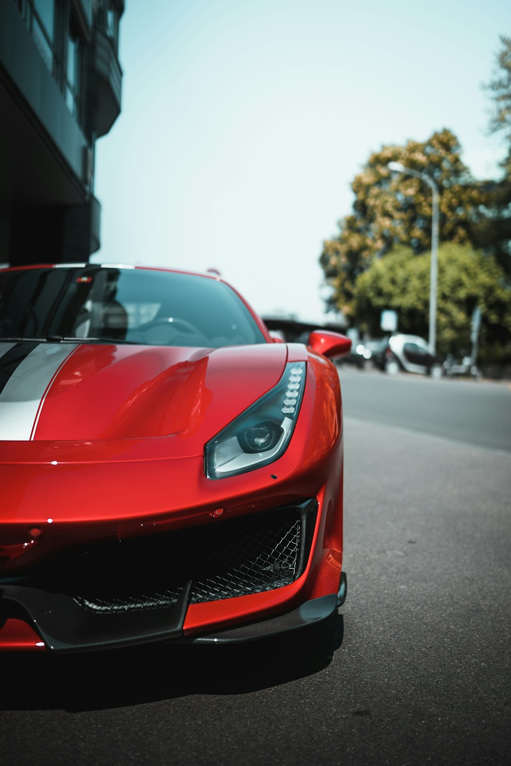 red ferrari 458 italia on road during daytime