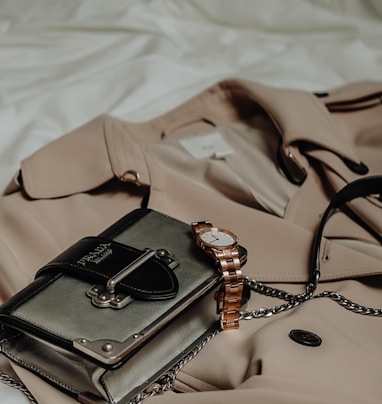 brown leather sling bag on white textile