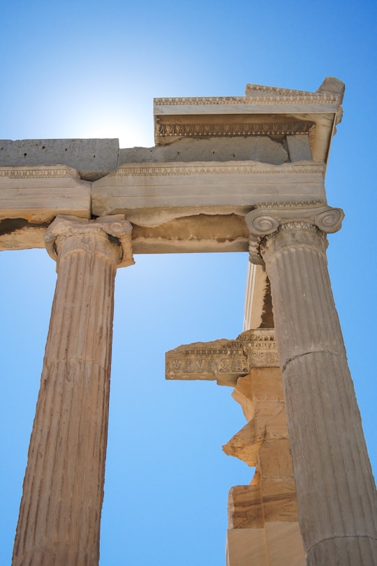 brown concrete pillar under blue sky during daytime in Parthenon Greece