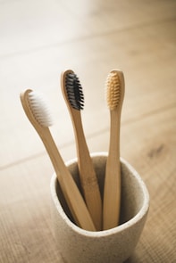 brown wooden sticks in gray ceramic bowl