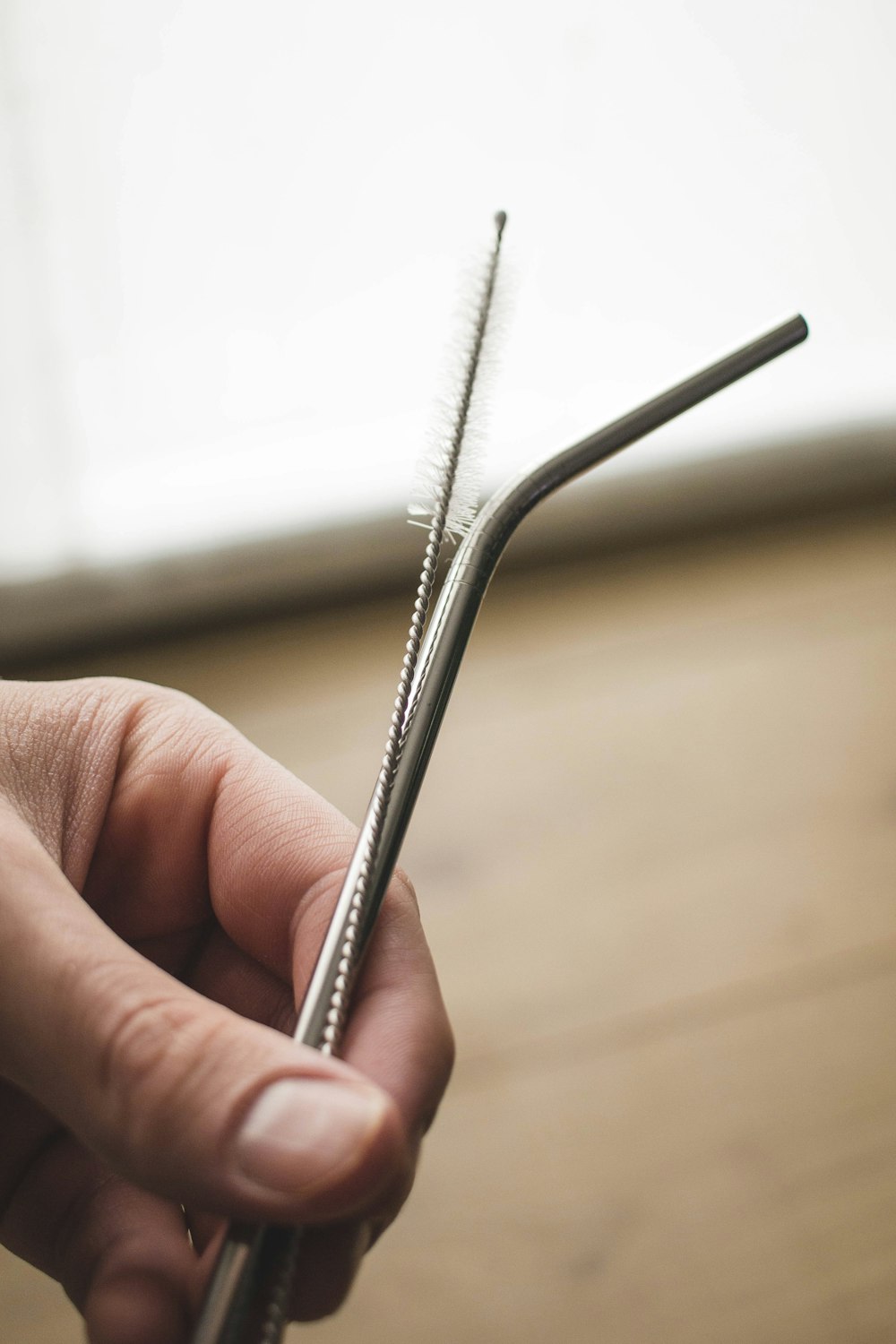 person holding silver steel bar