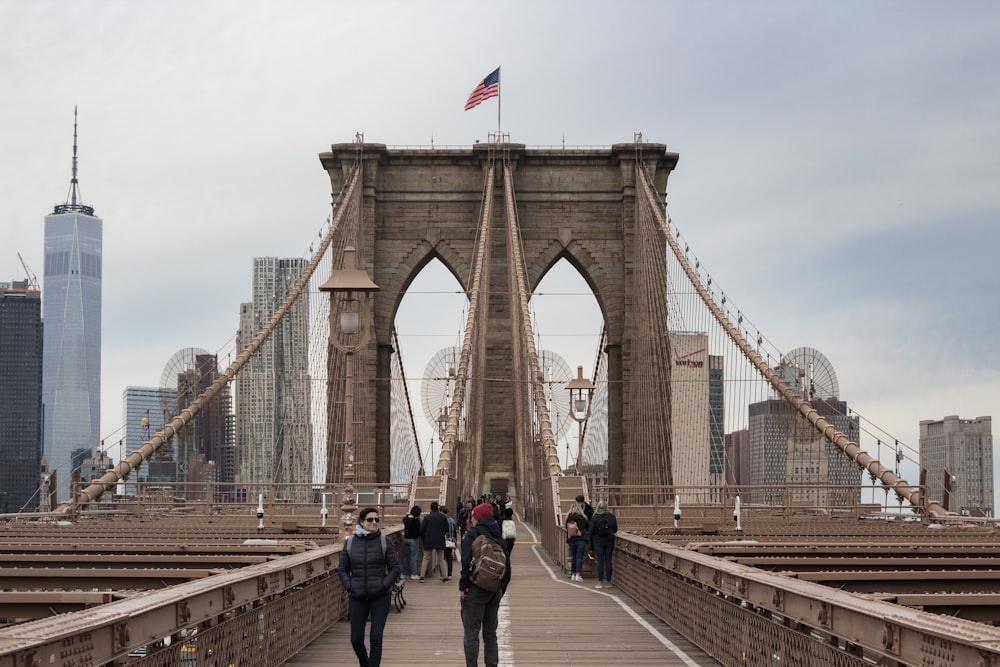 people walking on bridge during daytime