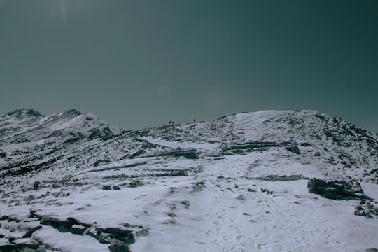 snow covered mountain under blue sky in Langtang National Park Nepal