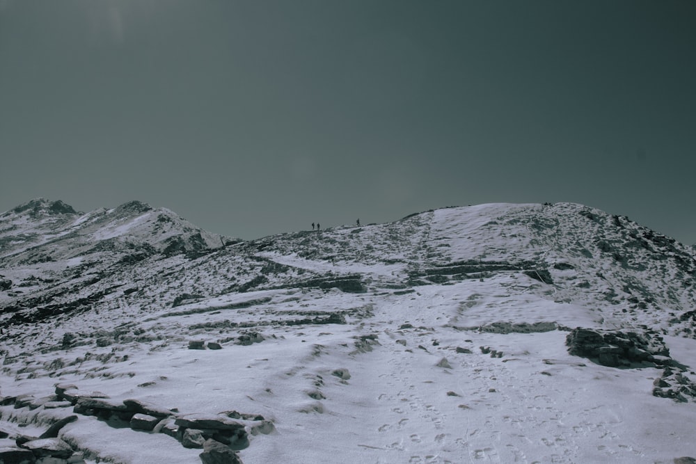 snow covered mountain under blue sky