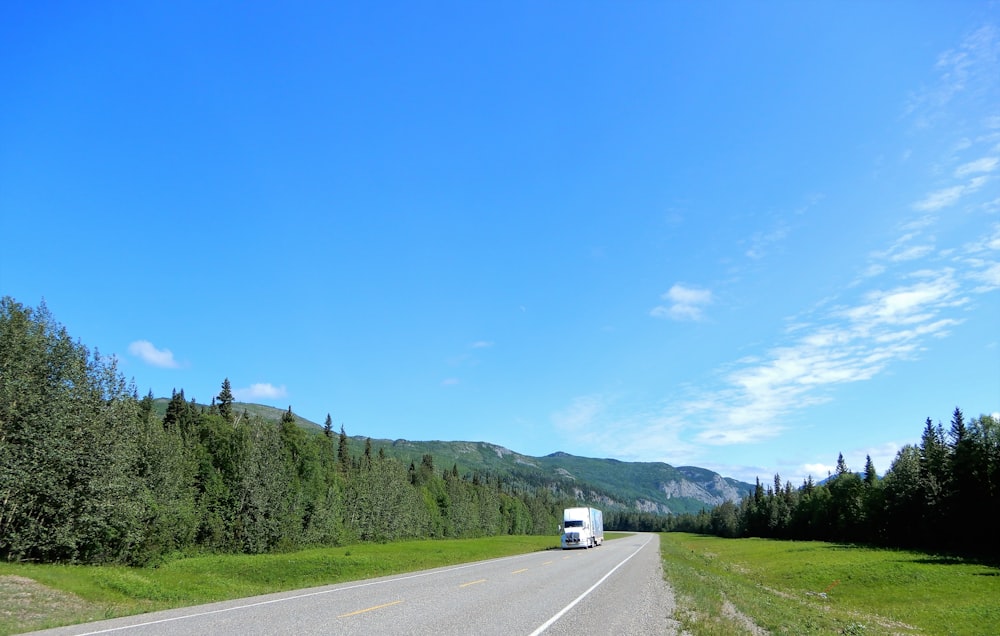 white car on road during daytime