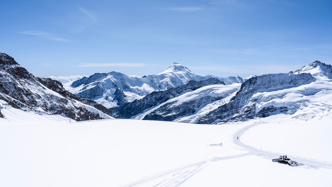 snow covered mountain under blue sky during daytime