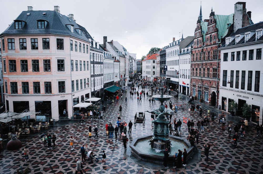 people walking on street near buildings during daytime