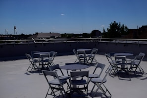 Casual team lunch at the London office rooftop with city skyline in the background