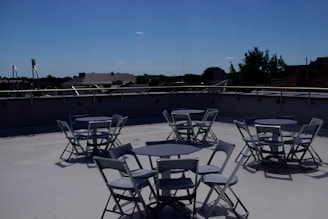 Casual team lunch at the London office rooftop with city skyline in the background
