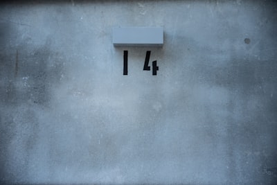 white letter y on blue concrete wall