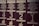 Several volumes of books with dark brown covers and gold embossed titles in Ukrainian, arranged in a row. Each book has a volume number prominently displayed, and there are decorative designs and images of leaves on the covers.