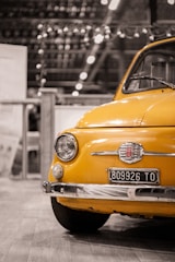 yellow car in grayscale photography