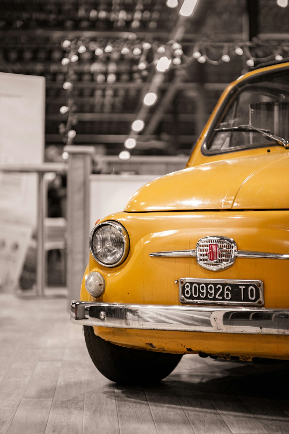 yellow car in grayscale photography