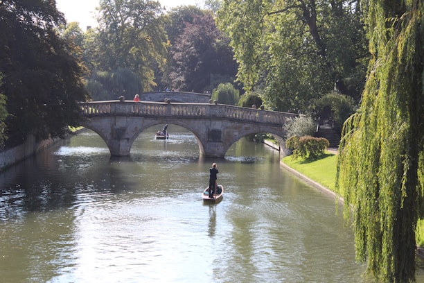 man in yellow jacket riding yellow kayak on river during daytime