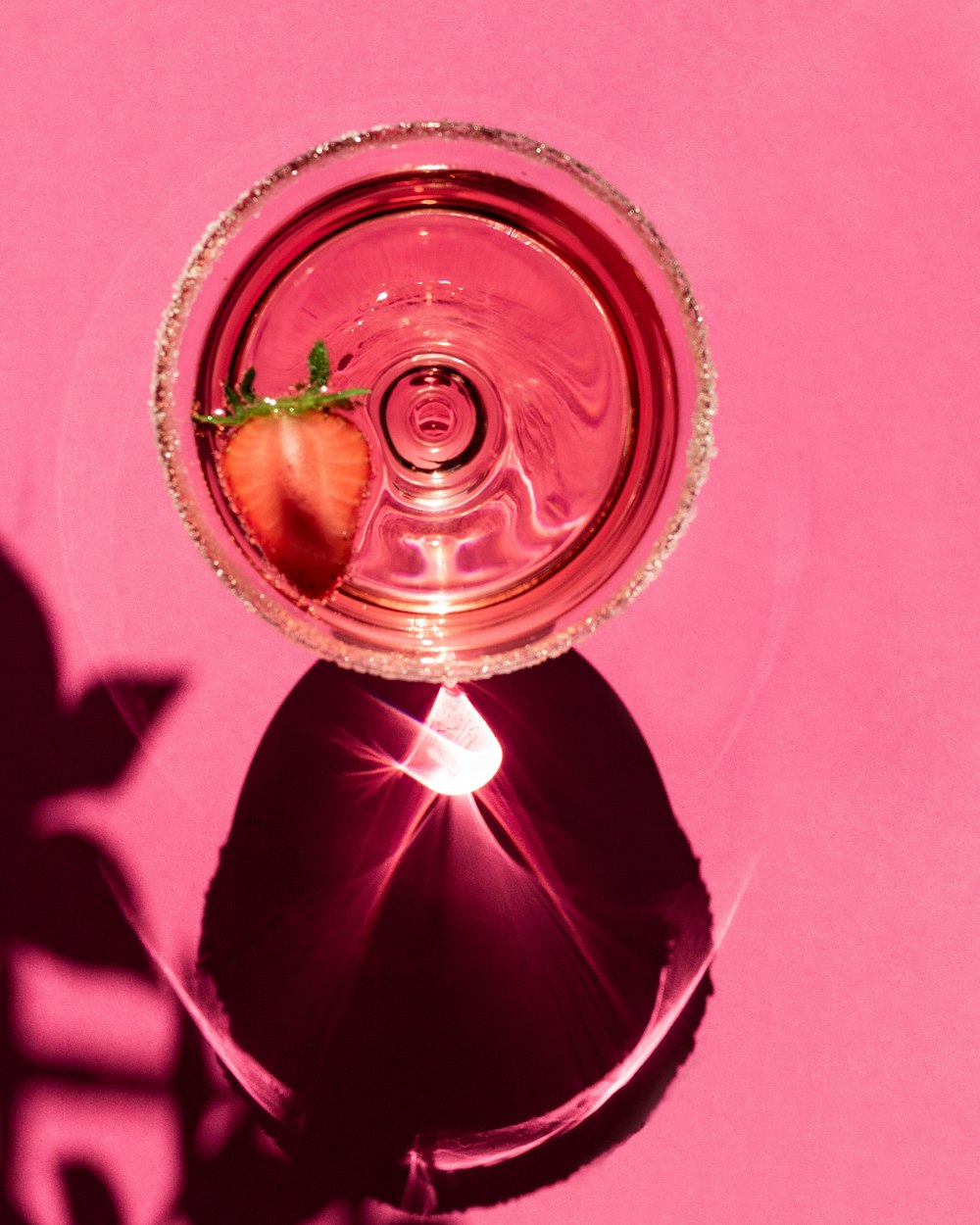 clear glass bowl on pink textile