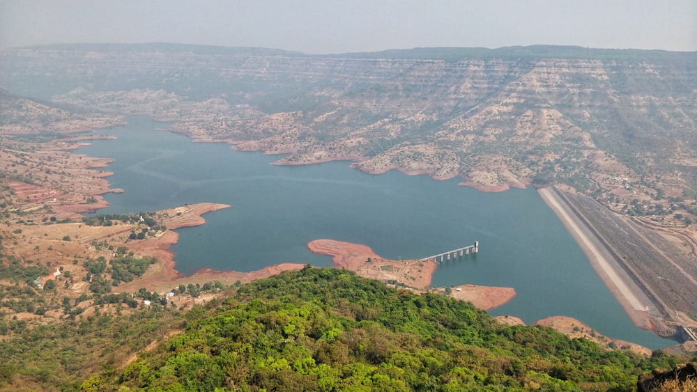 aerial view of lake between mountains during daytime