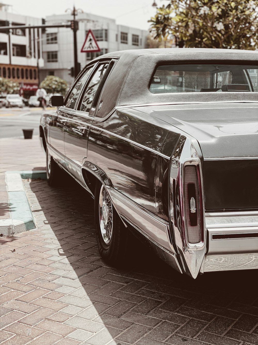 red and white vintage car on road during daytime