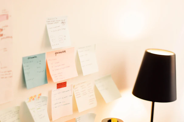 Close-up of handwritten notes and vocabulary flashcards spread out on a desk.