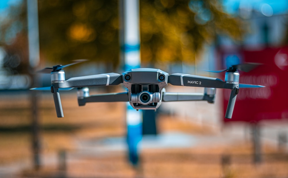 blue and black drone in close up photography