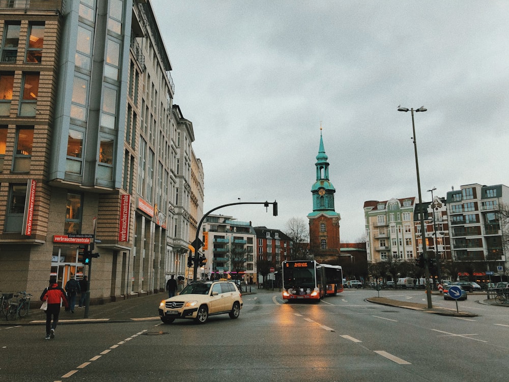 cars on road near buildings during daytime