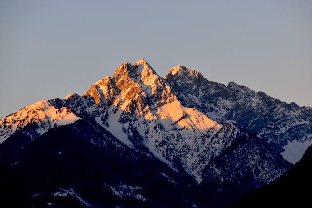 snow covered mountain during daytime