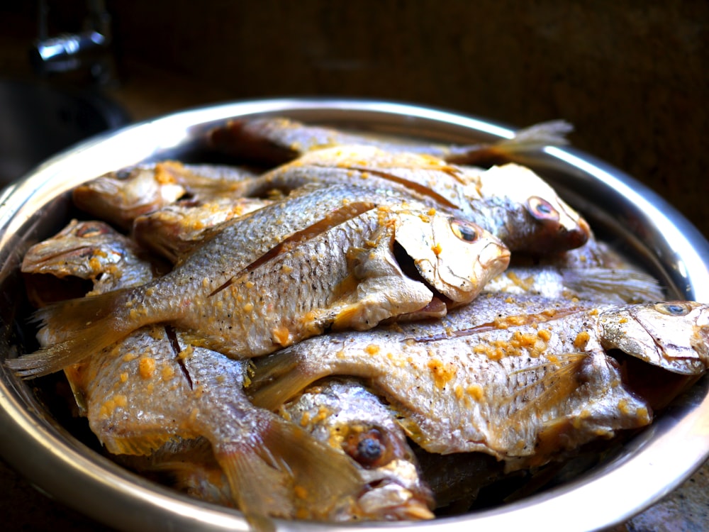 cooked fish on stainless steel plate