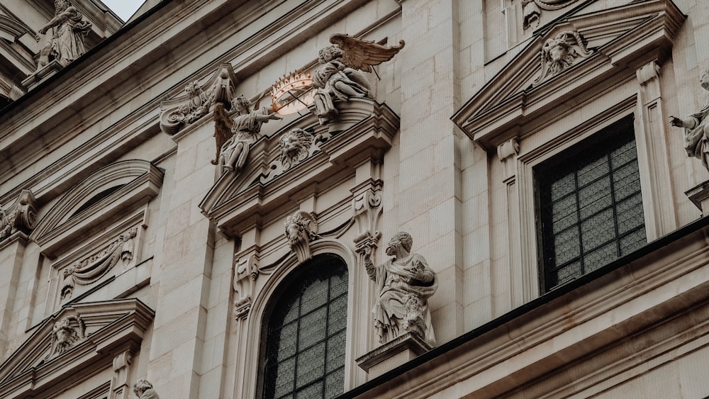 gold lion statue on brown concrete building