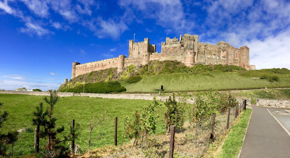 brown concrete castle under blue sky during daytime